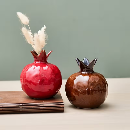 Brightly colored ceramic pomegranate vase - an exquisite decorative item.